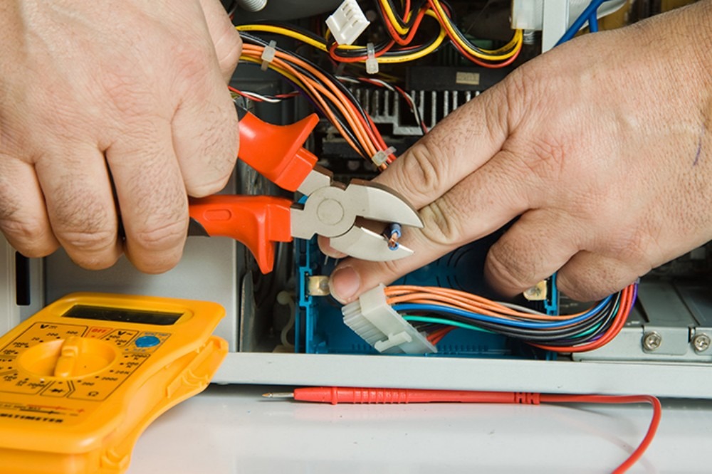 Electrician performing diagnostic work.